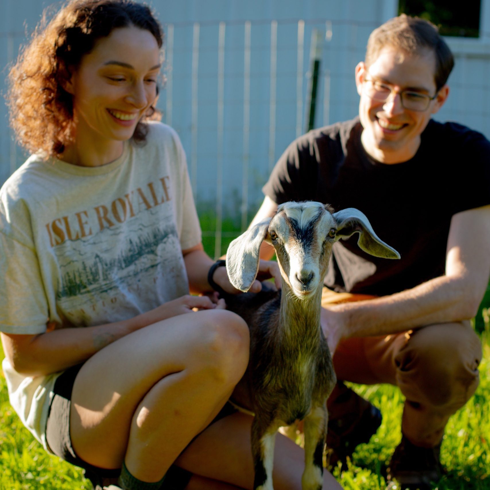 Troemner Family Farm proprietors with a goat.